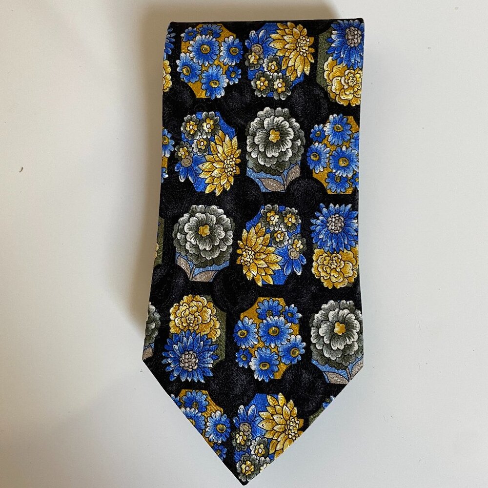Vintage Sazzari silk tie made in Italy with a floral pattern on black background